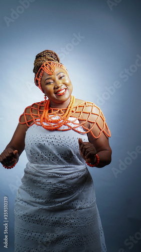 Portrait of beautiful African woman dressed in Nigerian Traditional attire photo