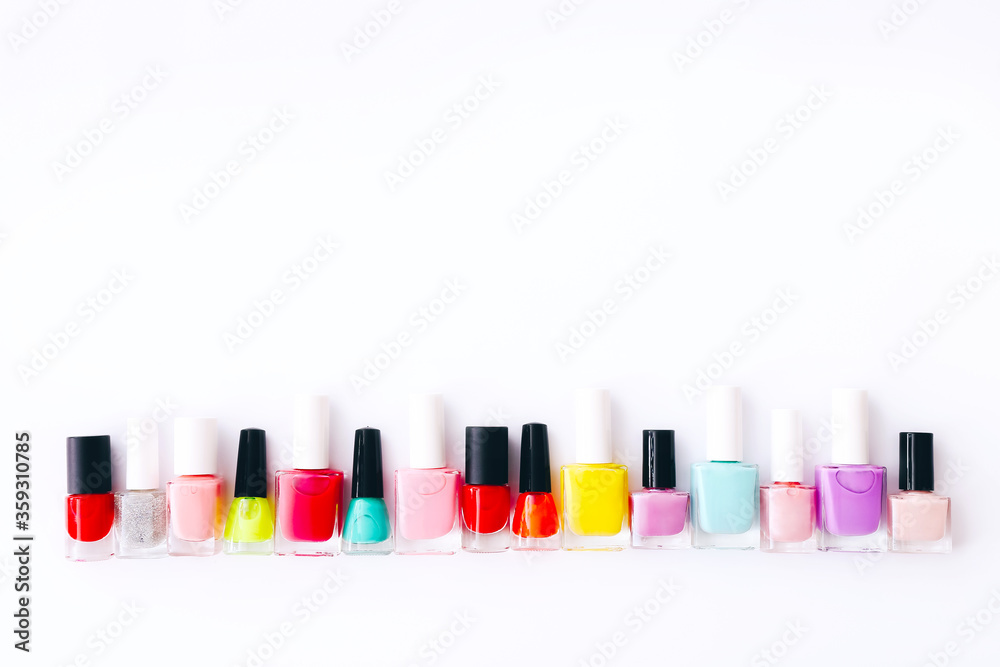 Group of nail polishes of different colors on white background Group of nail polishes of different colors on white background