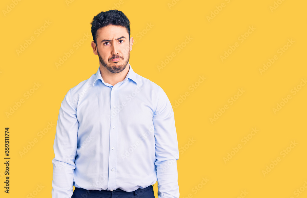 Young hispanic man wearing business clothes depressed and worry for distress, crying angry and afraid. sad expression. Young hispanic man wearing business clothes depressed and worry for distress, crying angry and afraid. sad expression.