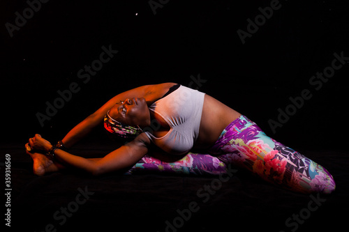 Pretty Black female doing Yoga poses