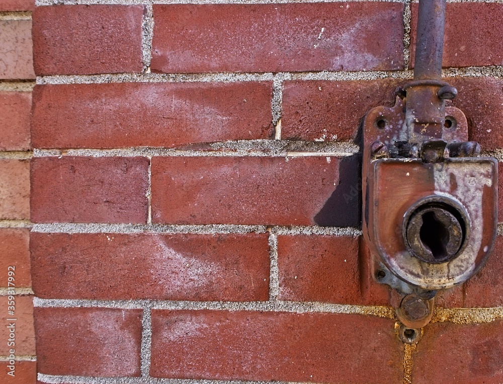 Awning crank on and abandoned brick building Awning crank on and abandoned brick building