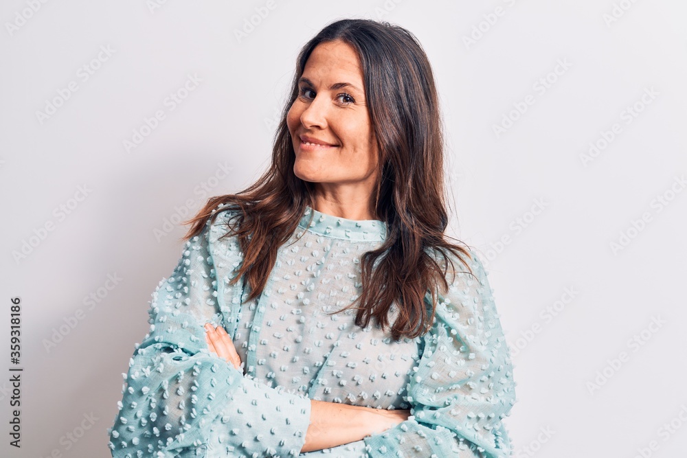 Young beautiful brunette woman wearing casual t-shirt standing over isolated white background happy face smiling with crossed arms looking at the camera. Positive person. Young beautiful brunette woman wearing casual t-shirt standing over isolated white background happy face smiling with crossed arms looking at the camera. Positive person.