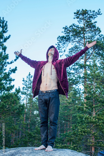 young attractive guy in woods alone practicing sport activity, lifestyle people concept
