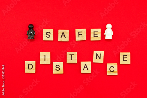 inscription safe distance and two people, concept of social distance and pandemic