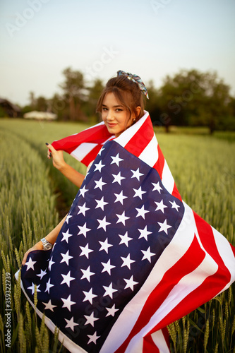 Independence day concept with woman holding american flag