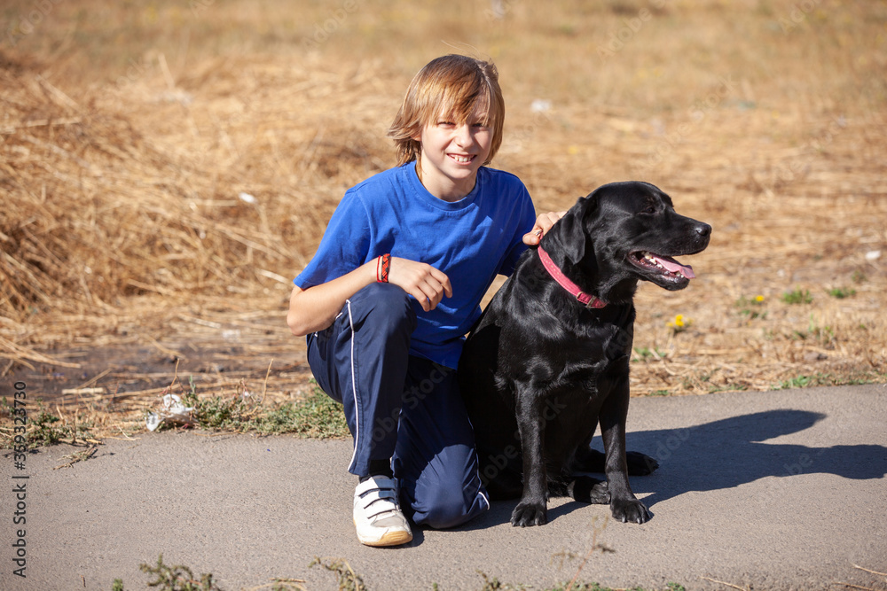 Best friends - Little boyl with dog at the nature Best friends - Little boyl with dog at the nature