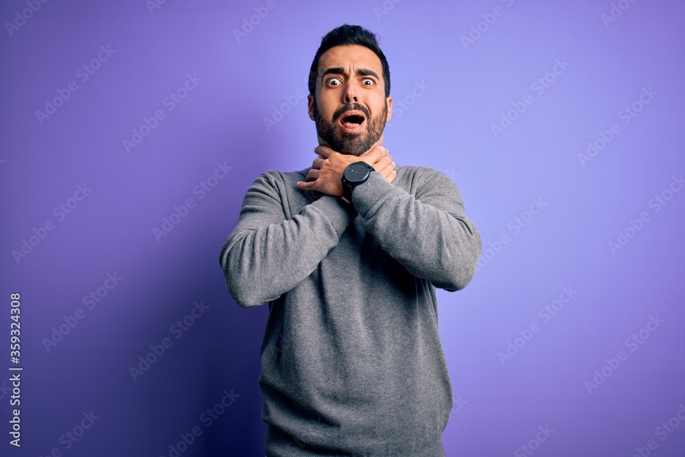 Handsome businessman with beard wearing casual tie standing over purple background shouting and suffocate because painful strangle. Health problem. Asphyxiate and suicide concept. Handsome businessman with beard wearing casual tie standing over purple background shouting and suffocate because painful strangle. Health problem. Asphyxiate and suicide concept.