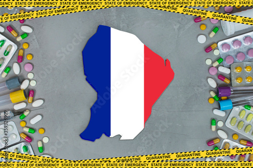French Guiana is struggling with an epidemic coronavirus pandemic. French Guiana quarantine measures and coronavirus. Medicine, drugs, needles, syringes and map and flag over gray background.