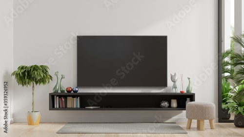 TV on wall and cabinet, living room.
