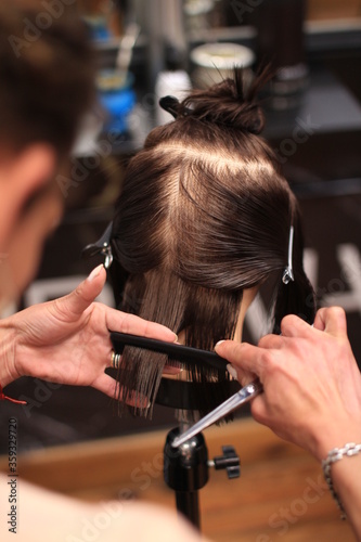 hairdresser cutting hair photo