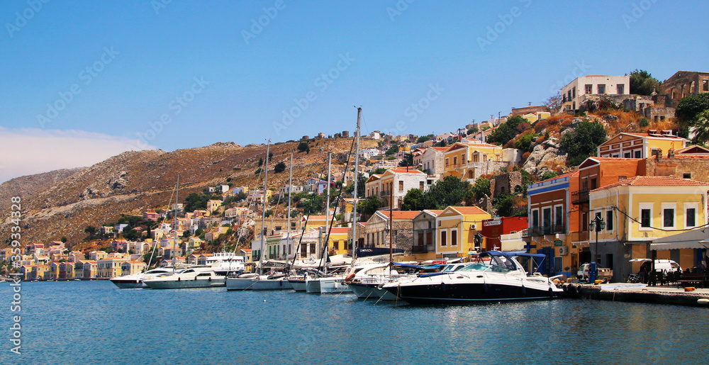 Symi town, Symi island, pictorial view of colorful houses and  Yialos harbour
