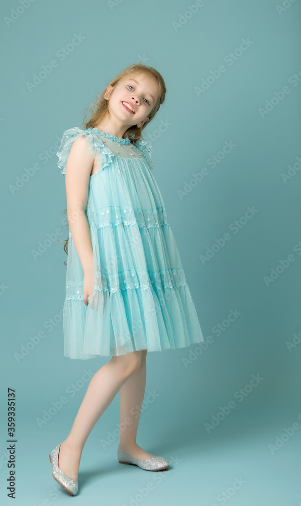 Elegant girl in a dress. Youth fashion concept, happy child. Elegant girl in a dress. Youth fashion concept, happy child.