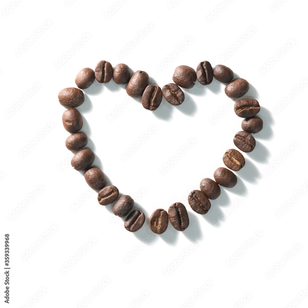 Love sign with coffee beans arranged Heart shape over white background. Love sign with coffee beans arranged Heart shape over white background.