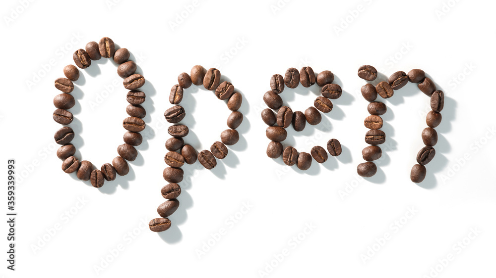coffee bean lettering close-up top view on white background. brown arabica coffee beans