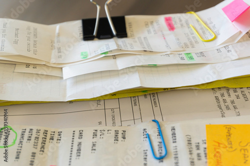 Credit card slips and invoices to claim business expenses on an expense report