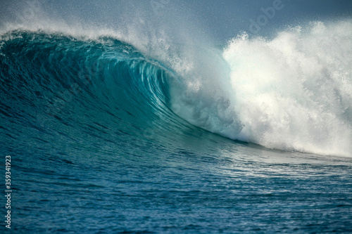 Perfect blue aquamarine wave  empty line up  perfect for surfing  clean water  Indian Ocean