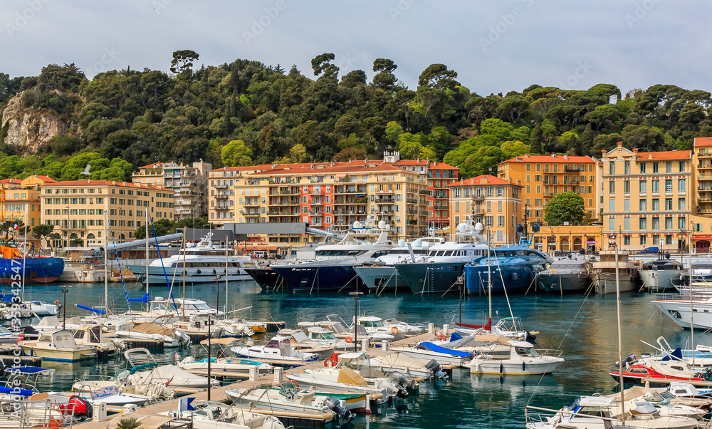 Panoramic view of boats in the marina and waterfront buildings in Nice port on the Mediterranean Sea, Cote d'Azur, France