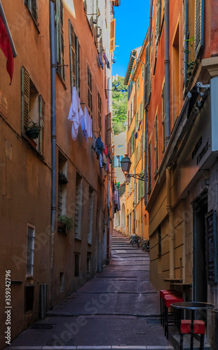 Fototapeta Naklejka Na Ścianę i Meble -  Old traditional houses in the narrow streets in the Old Town Vielle Ville in Nice in the South of France