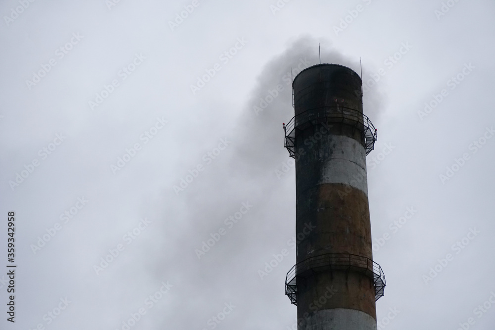 smoked industrial chimney in the cloudy sky, black smoke, environmental pollution smoked industrial chimney in the cloudy sky, black smoke, environmental pollution