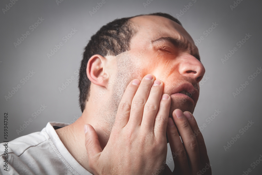 Man suffering from tooth pain. Man suffering from tooth pain.