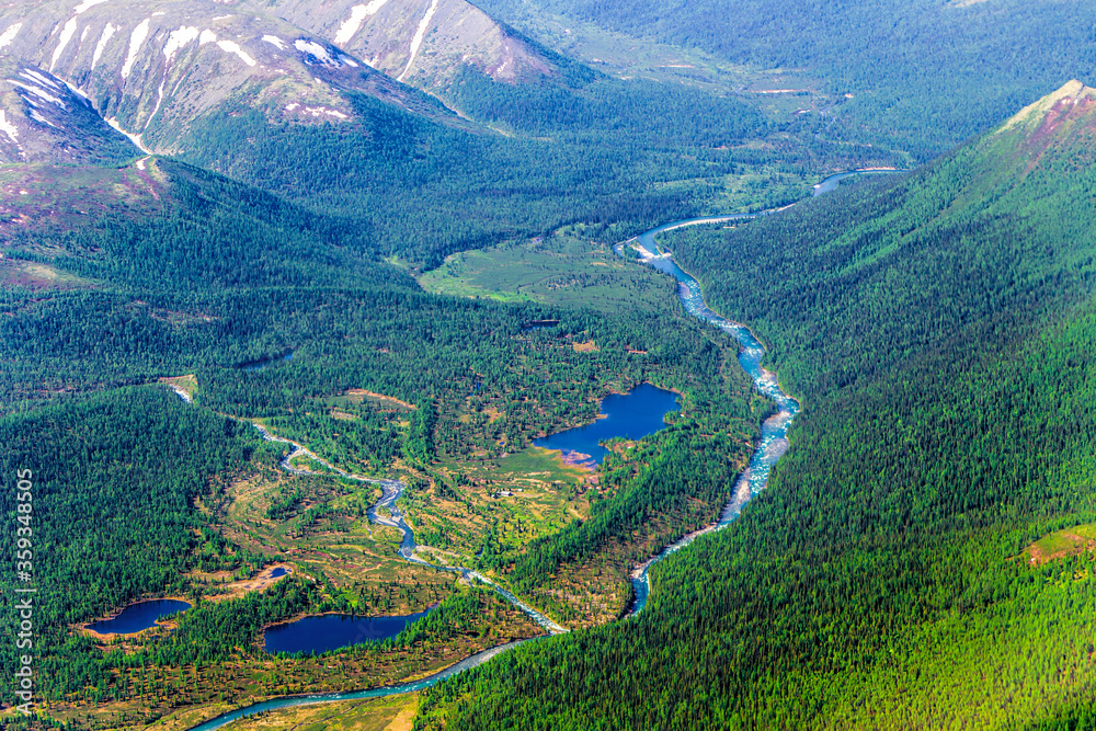 Confluence of two mountain rivers. Aerial view. Picturesque mountain landscape
