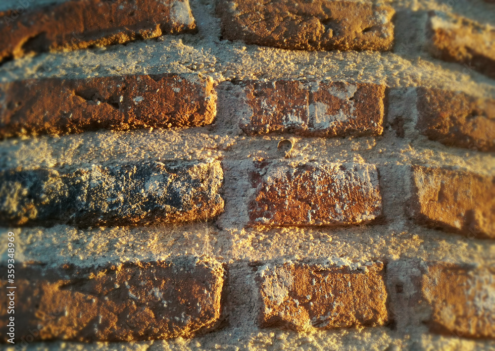 Reddish construction, texture. Ancient and genuine wall. Solid red clay brick very old. Reddish construction, texture. Ancient and genuine wall. Solid red clay brick very old.