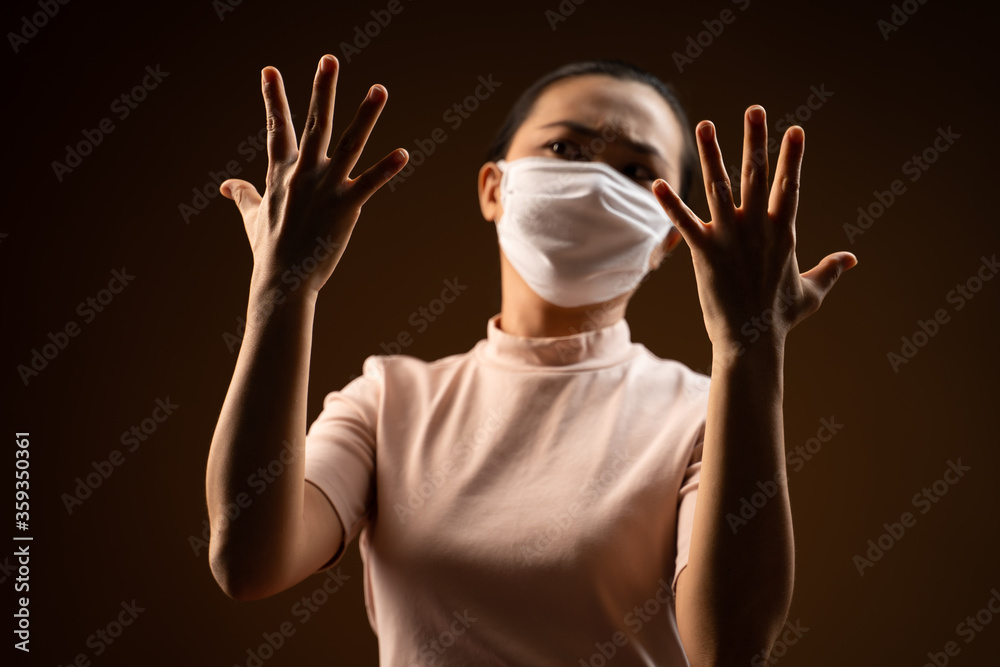 Don't Touch Your Face. Asian woman wearing protective face mask showing hand making stop sign. Don't Touch Your Face. Asian woman wearing protective face mask showing hand making stop sign.