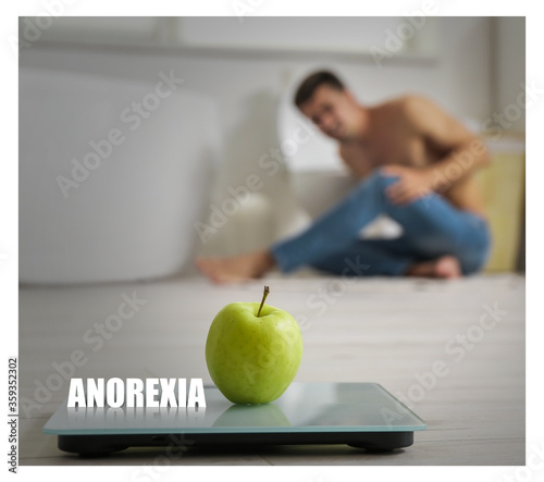 Scales with apple on floor ...