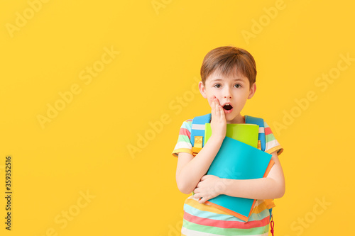 Surprised young schoolboy w...