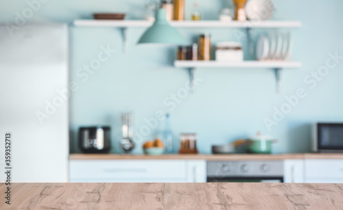 Empty table in modern kitchen © Pixel-Shot