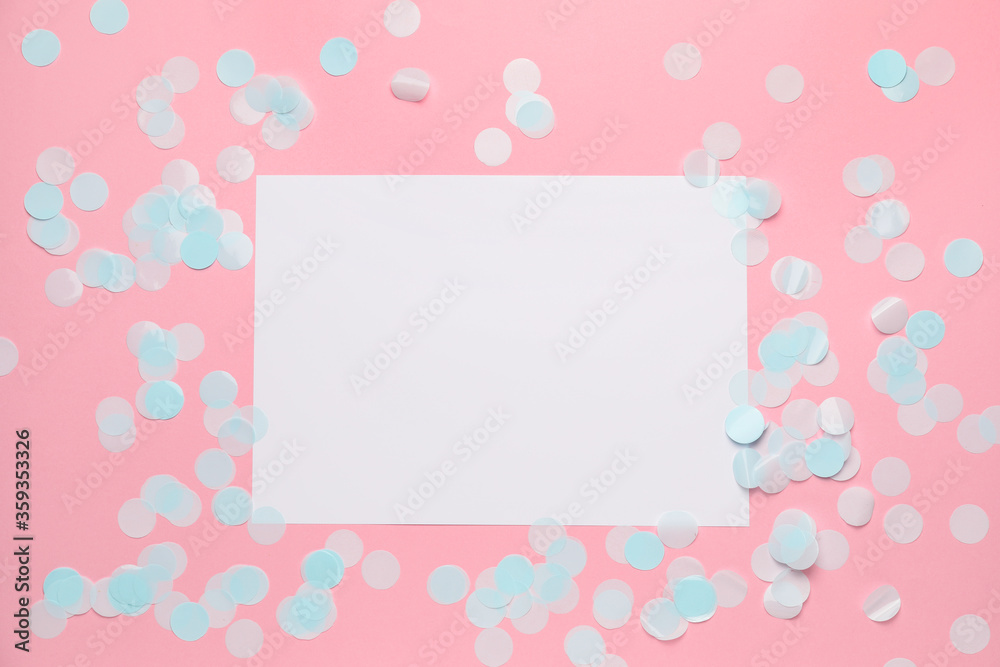 Blank card and confetti on color background