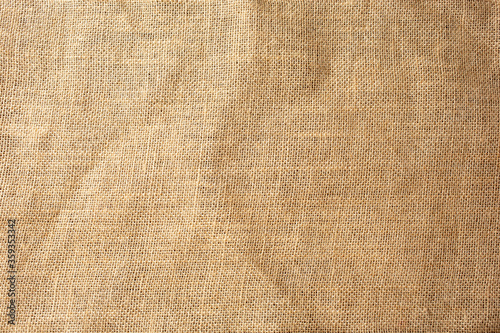 A top down view of industrial burlap surface, as a background surface.