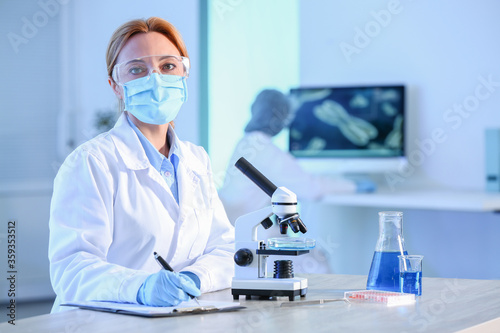 Scientist working with micr...
