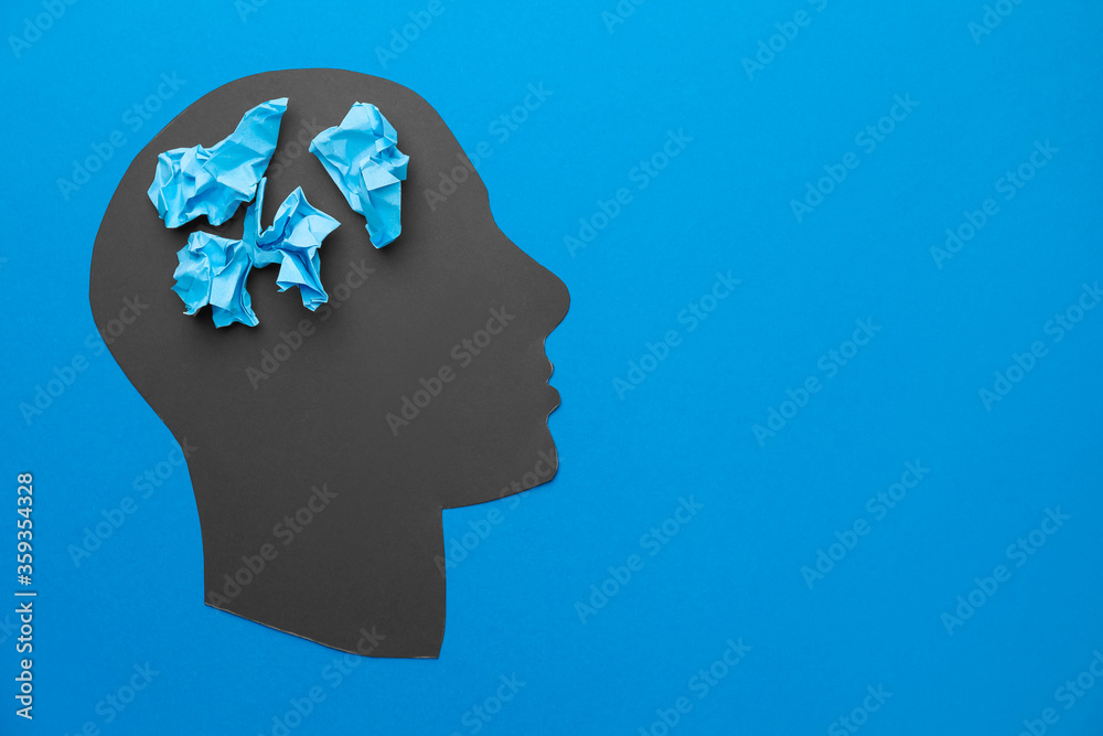Human head and crumpled papers on color background. Concept of dementia Human head and crumpled papers on color background. Concept of dementia