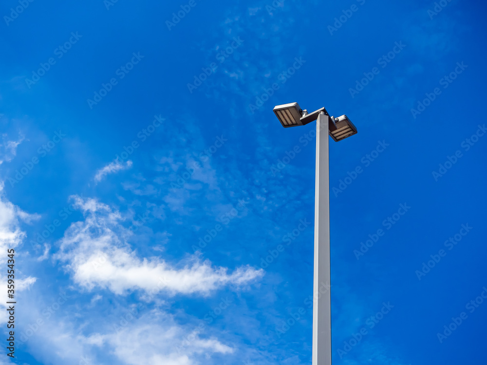 LED street lighting pole on blue sky background. LED street lighting pole on blue sky background.
