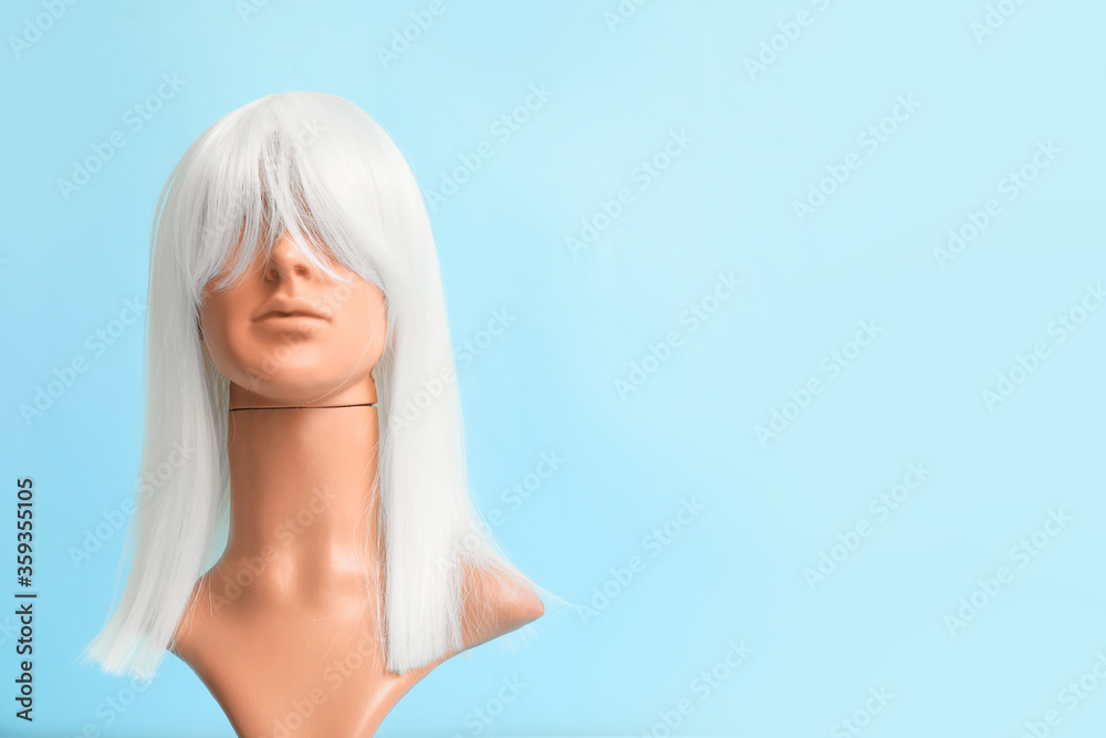 Obraz premium Mannequin with female wig on color background