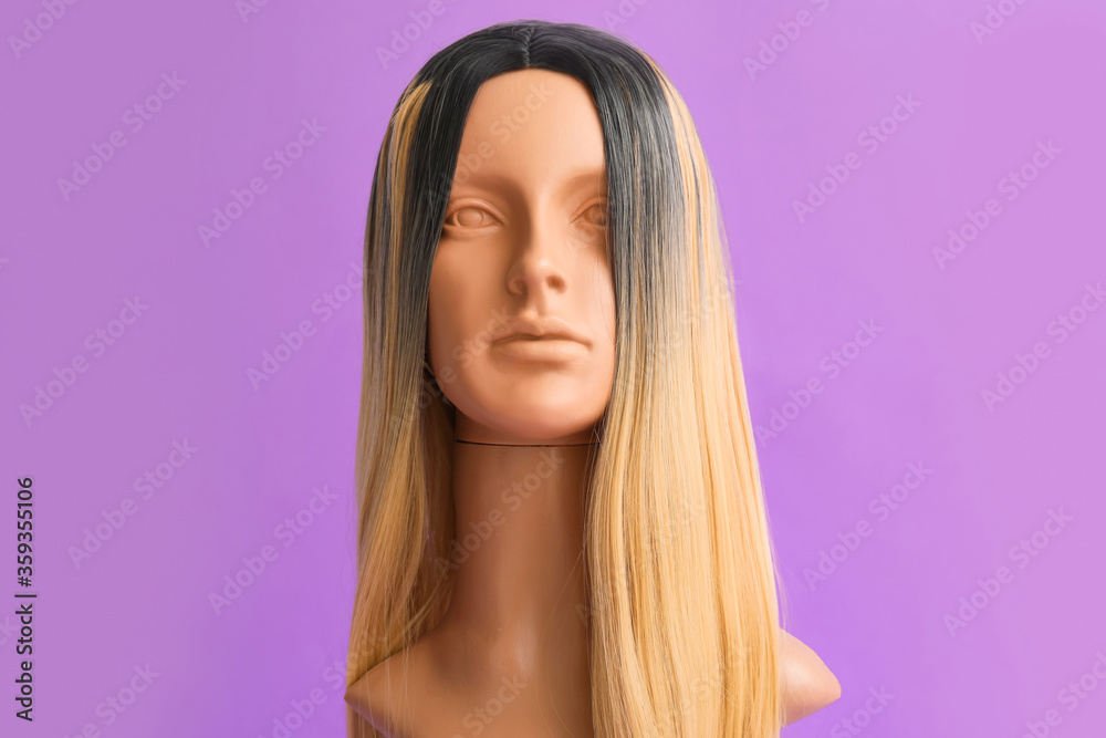 Mannequin with female wig on color background Stock Photo | Adobe Stock