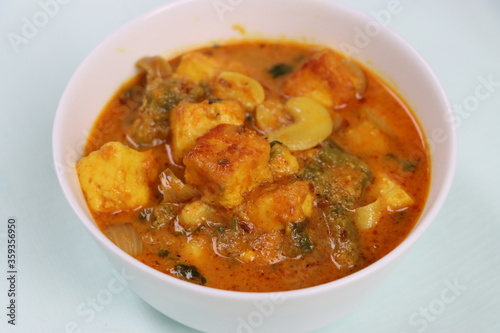 Paneer Kaju Masala, spicy cottage cheese indian curry with cashew and capsicum in coconut gravy