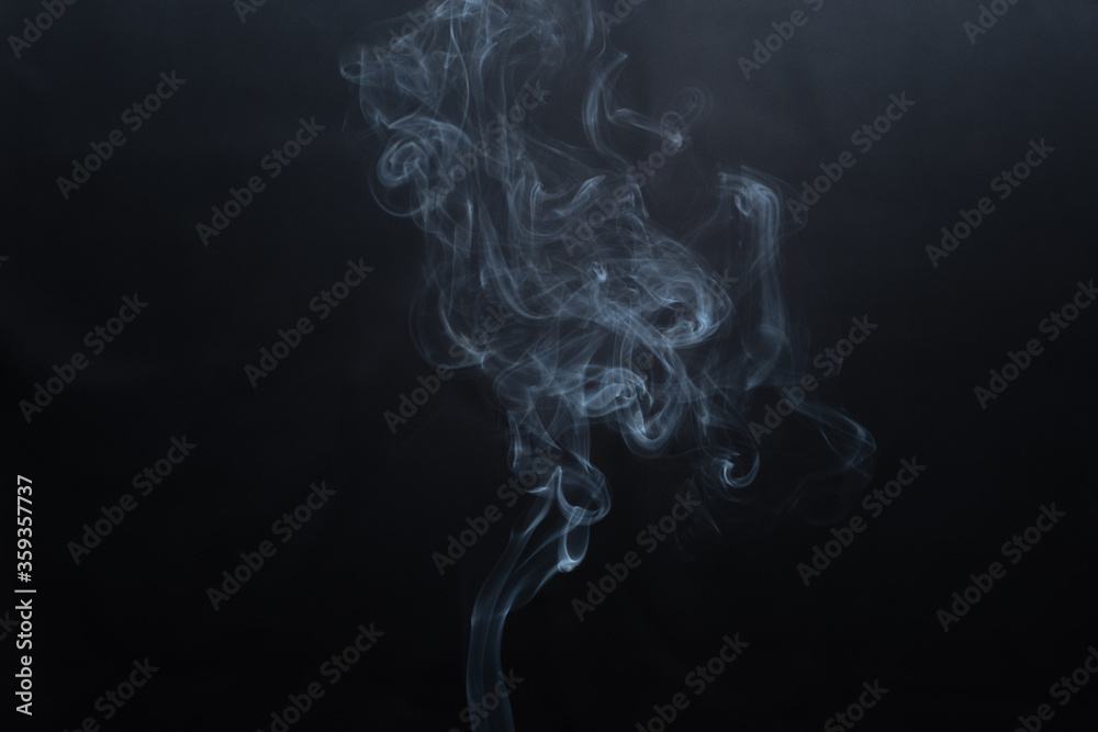 White smoke isolated on a black background. smoke image is like a ghost