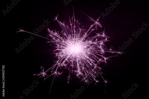 Burning sparklers isolated on black background, copy space, New Year Christmas concept