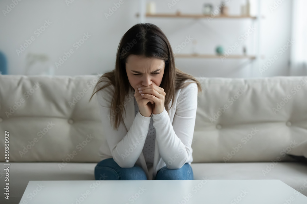 Woman feels depressed hopeless crying sit on sofa, upset female victim in trouble being offended abused, unplanned pregnancy and heavy decision about abortion, alcohol addiction need rehab aid concept Woman feels depressed hopeless crying sit on sofa, upset female victim in trouble being offended abused, unplanned pregnancy and heavy decision about abortion, alcohol addiction need rehab aid concept