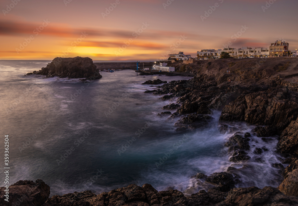 beautiful and dramatic sunset over the resort of El Cotillo in Fuertaventura beautiful and dramatic sunset over the resort of El Cotillo in Fuertaventura