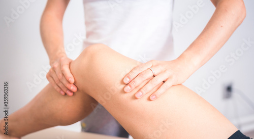 Bild auf Leinwand Physiotherapist working with woman giving her massage