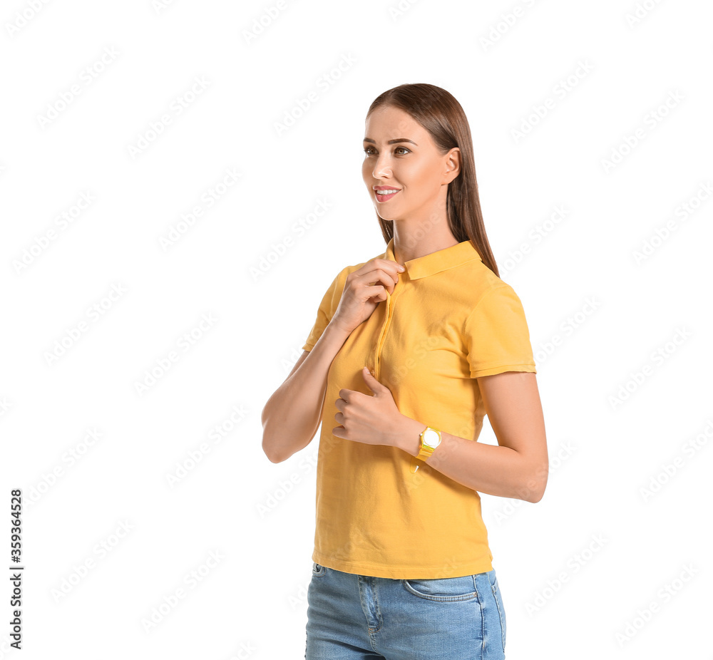 Beautiful young woman in stylish polo shirt on white background