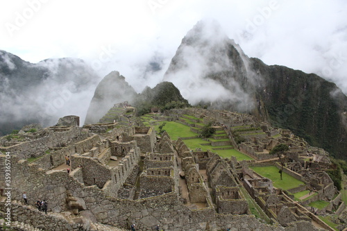 Machu Picchu, in Peru, in a foggy morning. 