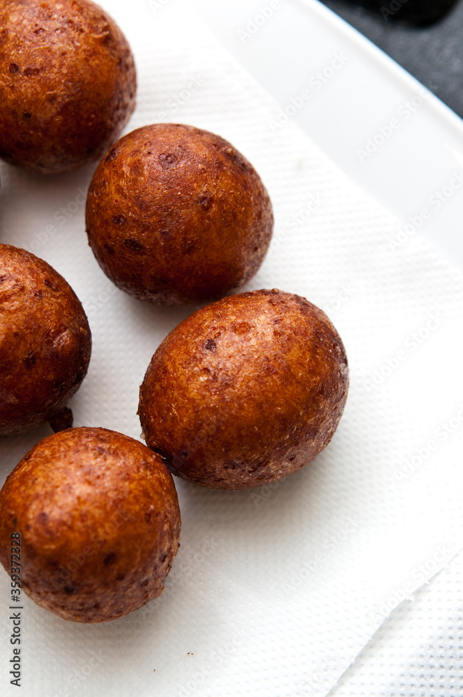 Fat Thursday homemade donuts on a plate, delicious Polish sweet food