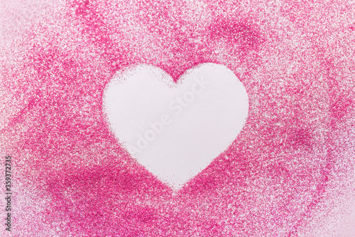love and valentine s day concept - heart shape on pink glitters on white background