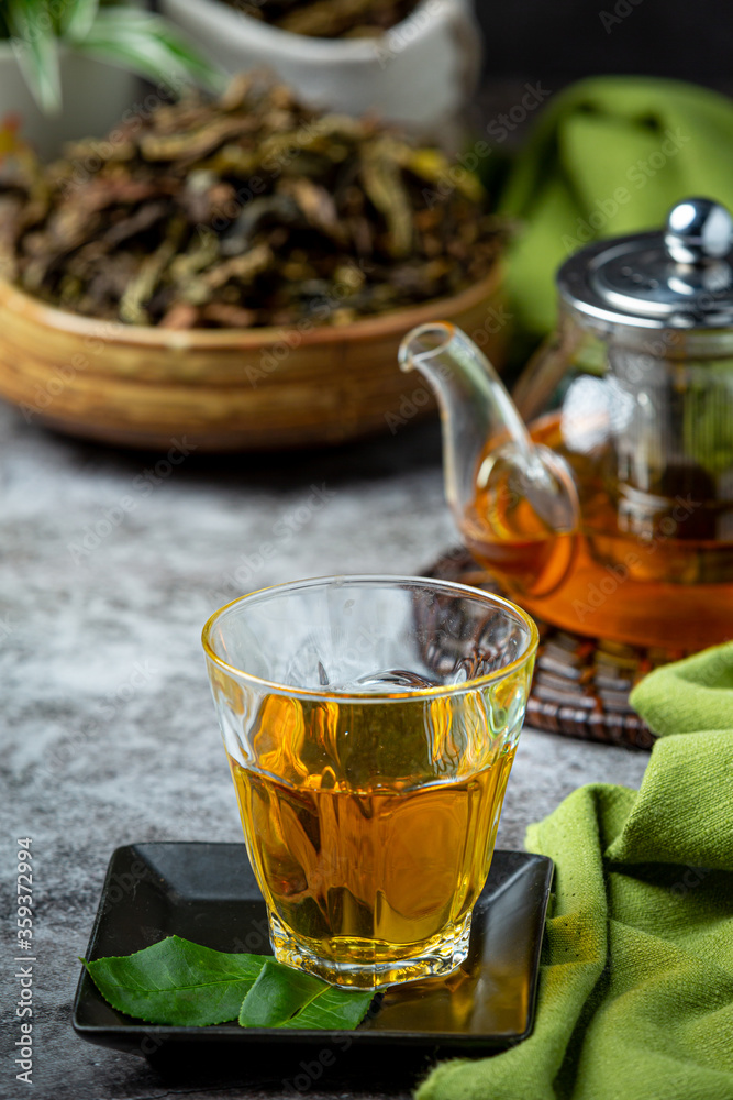 Oolong green tea in a teapot and bowl. Oolong green tea in a teapot and bowl.