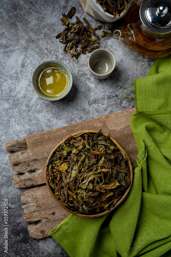 Oolong green tea in a teapot and bowl.