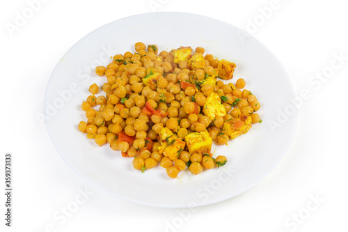 Boiled chickpeas, stewed with tomatoes and Adyghe cheese on dish